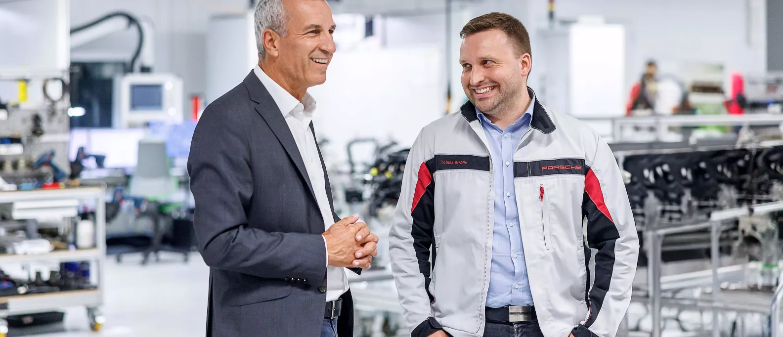Albrecht Reimold, Member of the Board at Porsche, with Porsche Employee