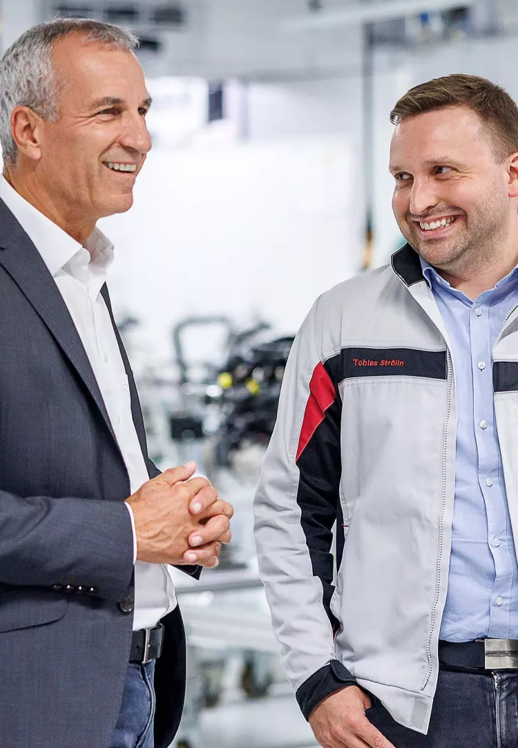 Albrecht Reimold, Member of the Board at Porsche, with Porsche Employee