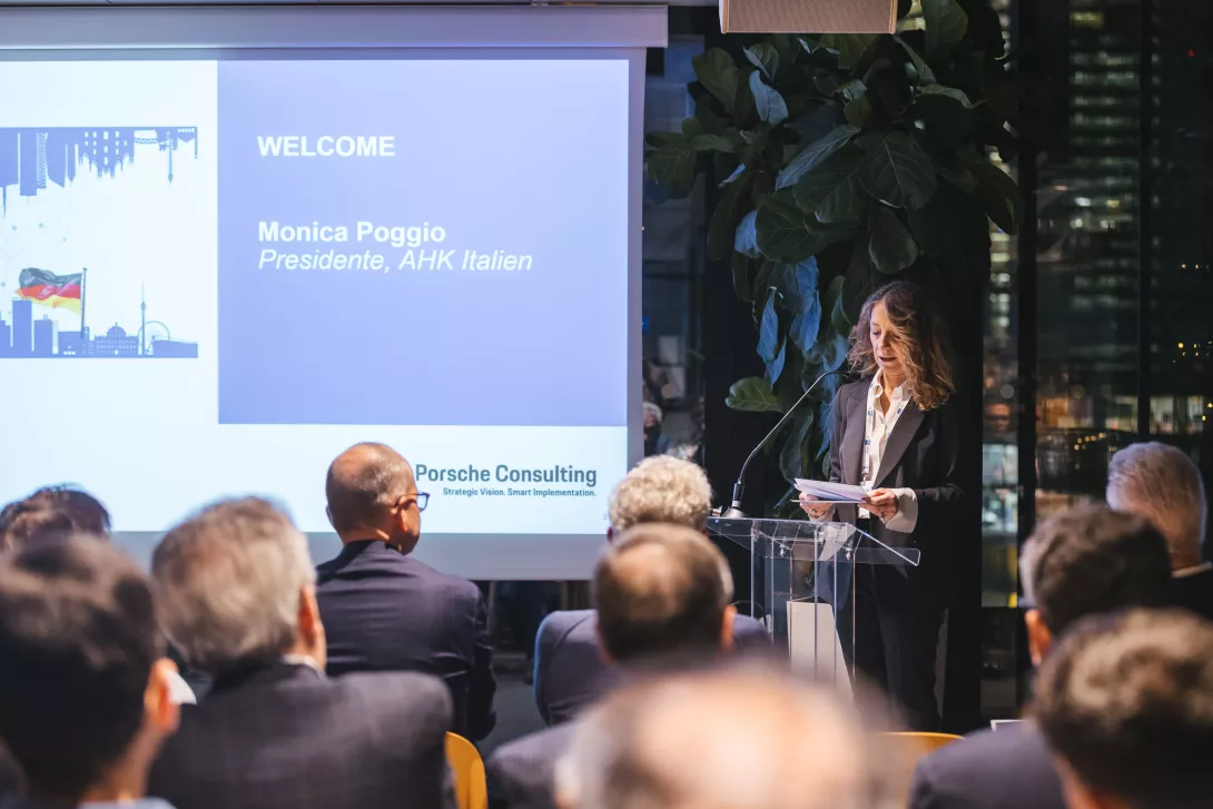 Monica Poggio speaking on stage