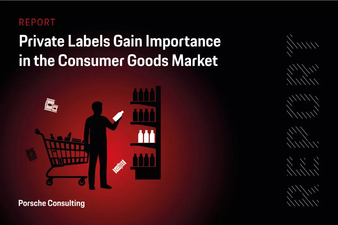 A shopper standing beside a shopping cart and a store shelf, holding a product while comparing packaged goods.